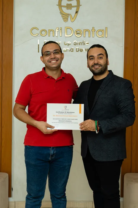A graduate with their ConfiDental certificate of attendance