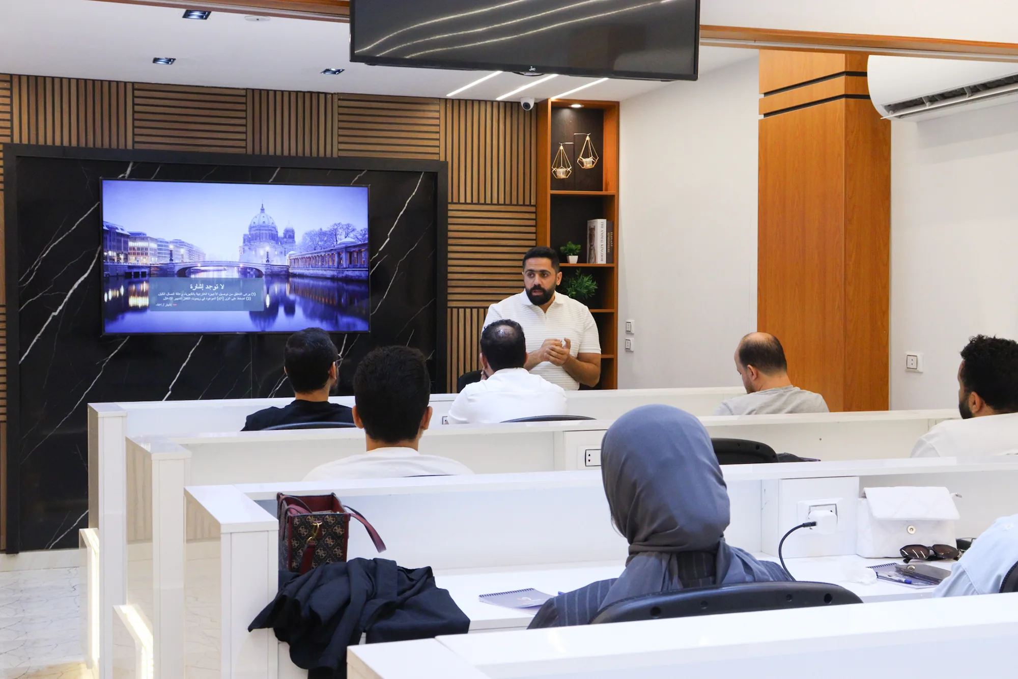An instructor teaching a session to dentists at ConfiDental Education Center