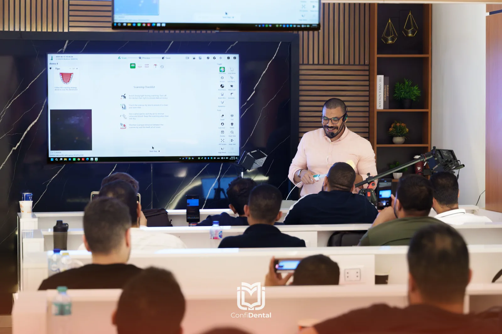 An instructor presenting to a full lecture room